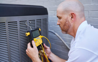 Man working on an air conditioner