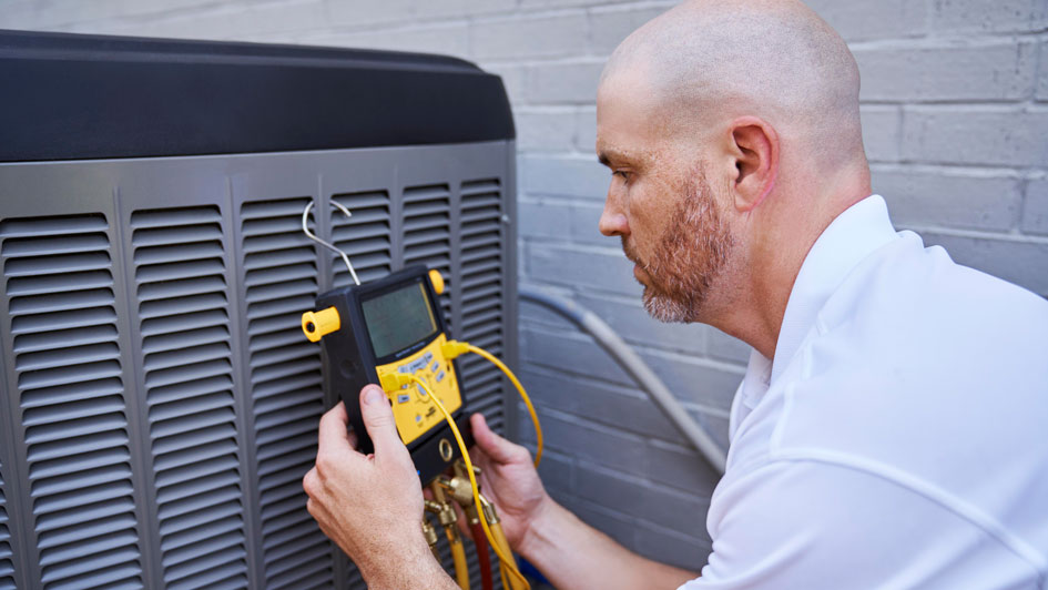 Man working on an air conditioner